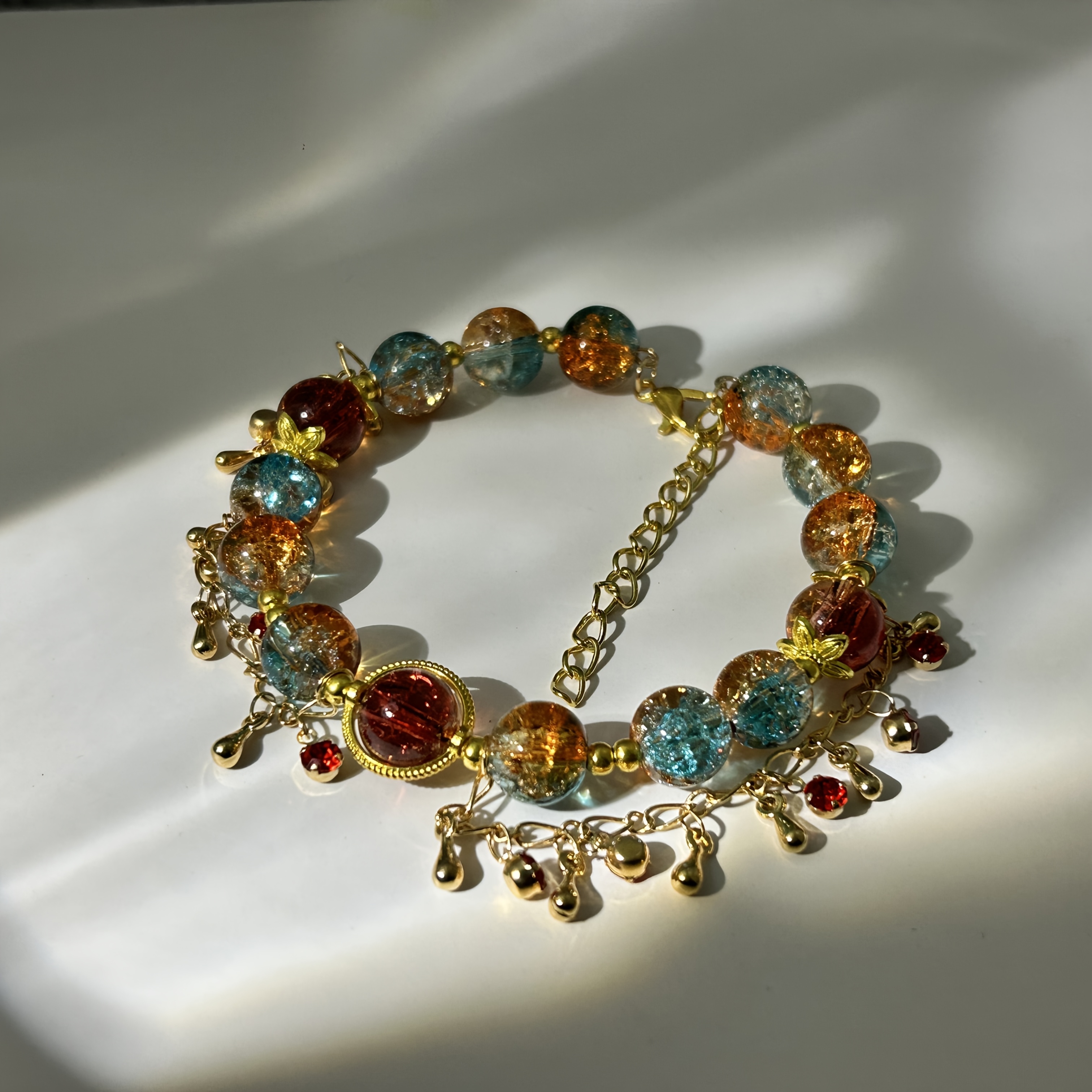 TEMU The " Dream Hu" Bracelet Features A Blend Of Orange And Crescent , With Vibrant Orange And Blue Resin Beads. It Has An Adjustable Chain And Is