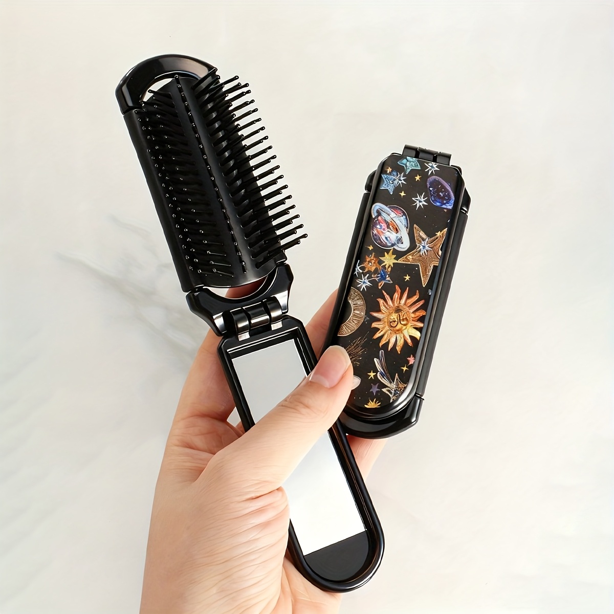 Image of 1pc Folding Comb With Small Mirror, Hair Brush, Pocket Comb, Travel Comb, Abstract Colorful Flower, Star, Moon, Starry Sky Pattern, Dark Style, Compact And Portable Bag Comb, Unisex, Gift