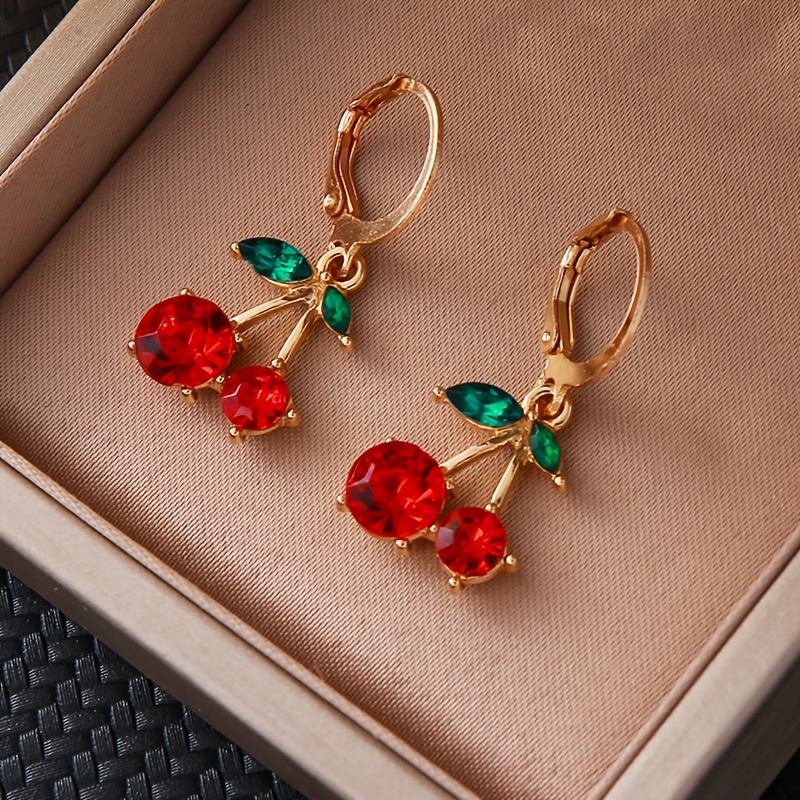 a pair of minimalist and stylish cherry pendant earrings a   item that embodies light luxury and   suitable for everyday wear as well as parties and formal events without battery