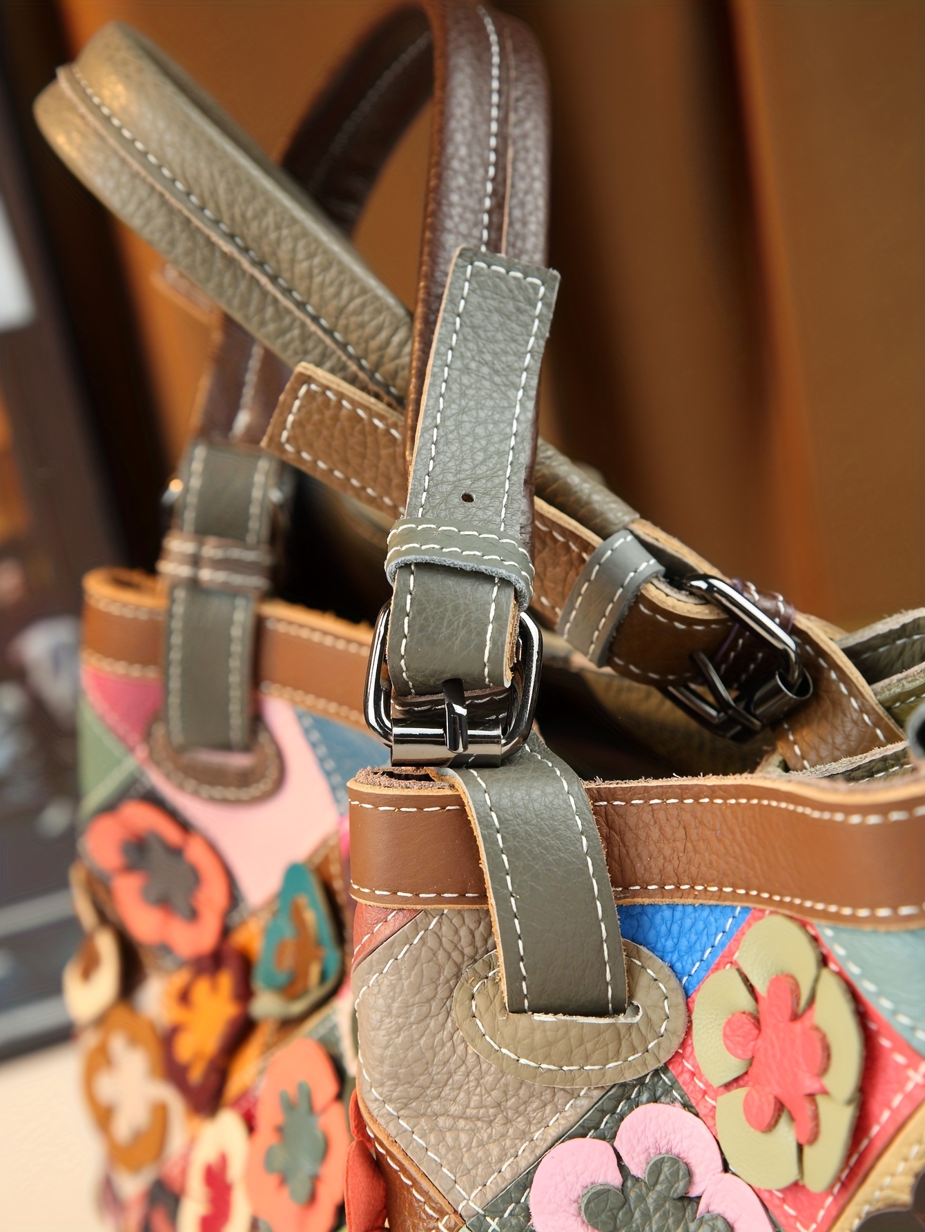 Close-up of golden tone hardware and strap loop