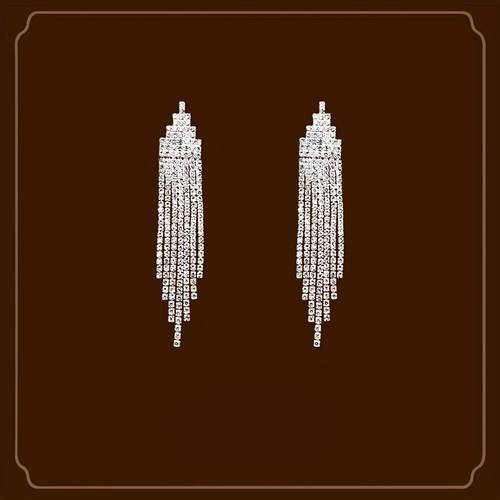 a pair of elegant and long tassel earrings with rhinestones clip that pierced ears suitable for women wear weddings evening parties and other occasions