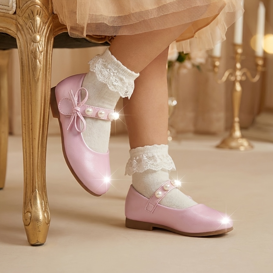 item picture pink   dress shoes for girls with   pearl ankle straps and side bow decorations non slip soft flat soles   birthday parties with skirts stage performances as princess shoes and suitable for   daily wear and formal