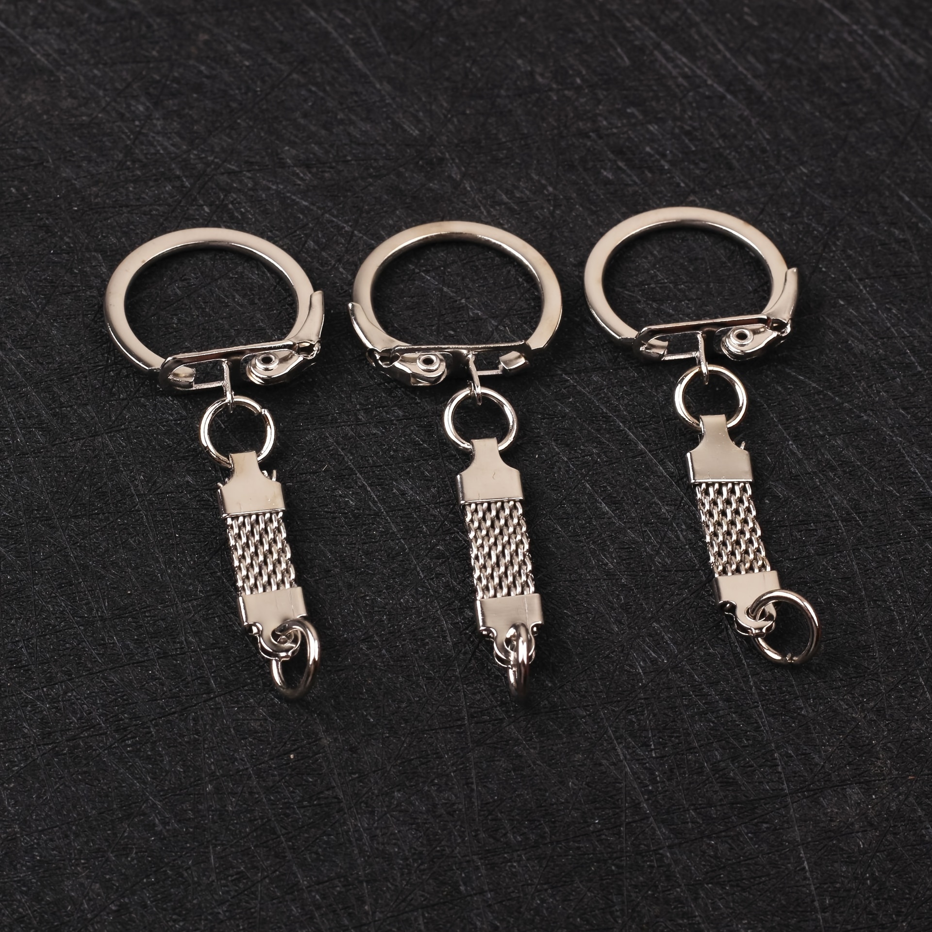 

A Set Of 10 Detachable Key Rings With Chains, Key Ring Loops, Open Jump Rings, And Connectors, Used For Diy Crafts To Make Jewelry.