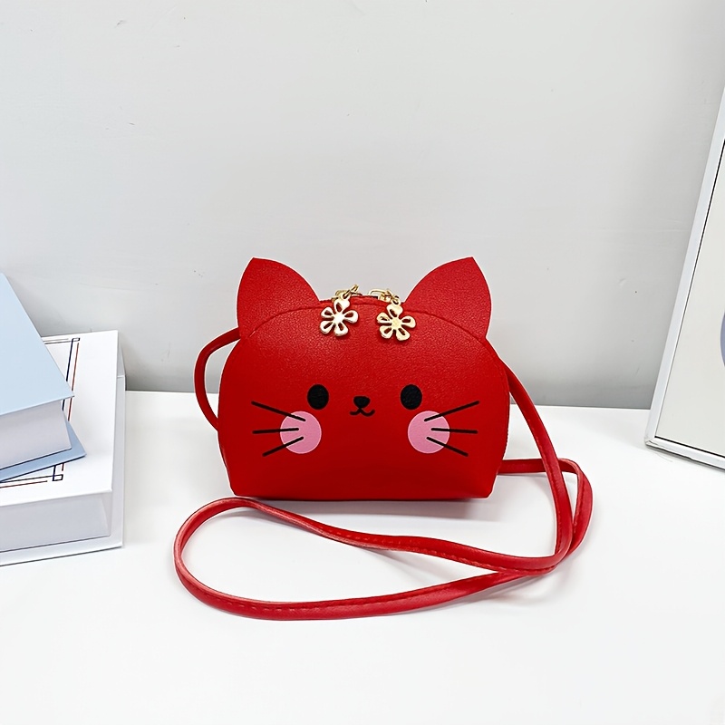 Image of A Fashionable And Small Handbag Showcasing An Adorable Cartoon Cat Motif, Ideal For Holding And Other Necessities