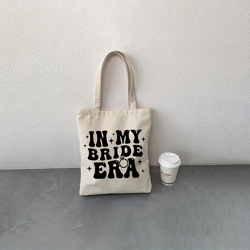 

1pc In My Bride Era Pattern Tote Bag, Canvas Shoulder Bag For Travel & Daily Commuting, Shopping Luggage Bag, Best Gift For Her, Trendy Folding Handbag, Engagement Gift, Bride Gift, Wedding Gift