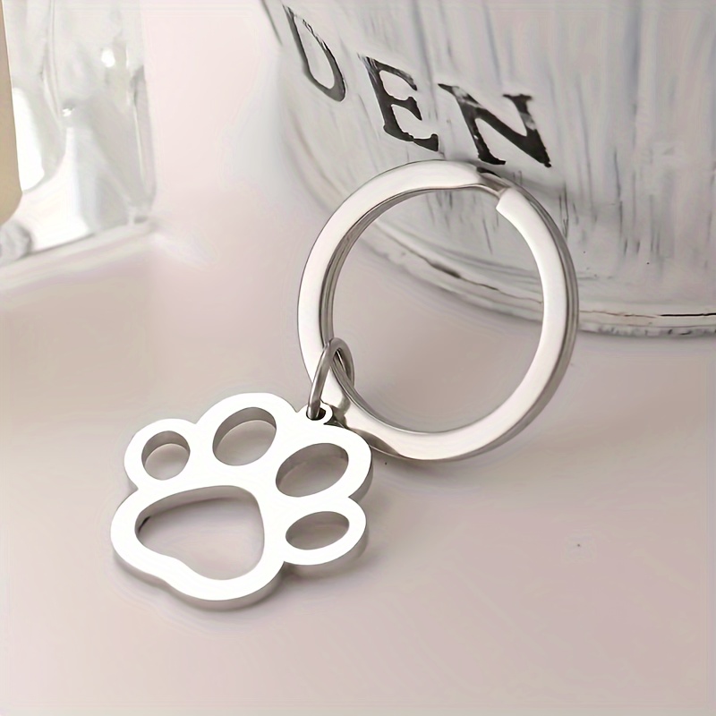 1pc Stainless Paw Keychain For Men, Stylish Silvery Cartoon Dog Paw Keyring, Car Keychain, Pet Collar Pendant, Hollow Paw Charm, Men's Keyring.