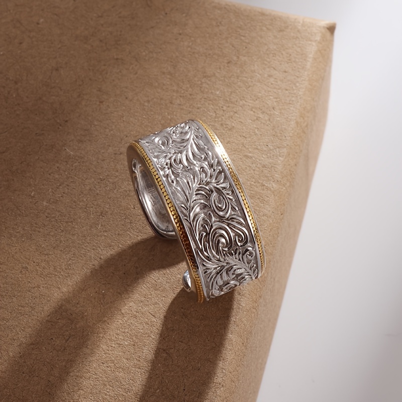 A Ring With A Copper Floral Pattern