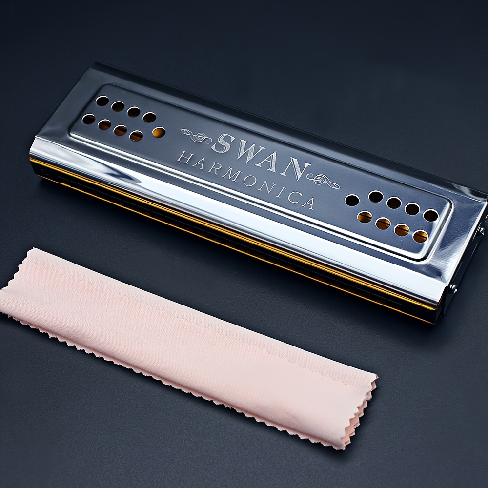 

Harmonica polyphonique Swan à 24 trous en sol, en métal avec polie, un chiffon de nettoyage et un étui ( du chiffon de nettoyage peut varier)