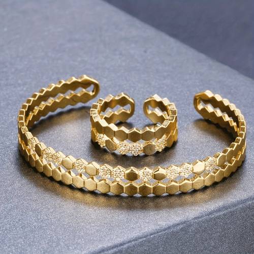 a set of fashionable womens adjustable honeycomb style bracelet and ring