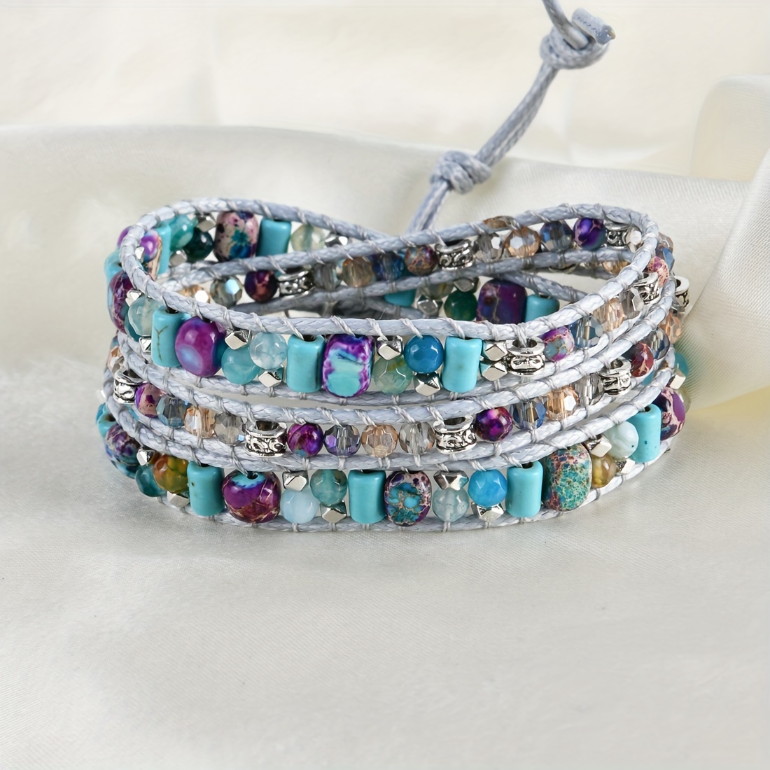 

Bracelet with multiple layers adorned with colorful stones, in a bohemian and ethnic style, handcrafted for women.