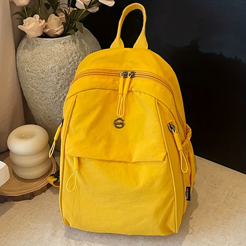 yellow backpack sold on Temu United States