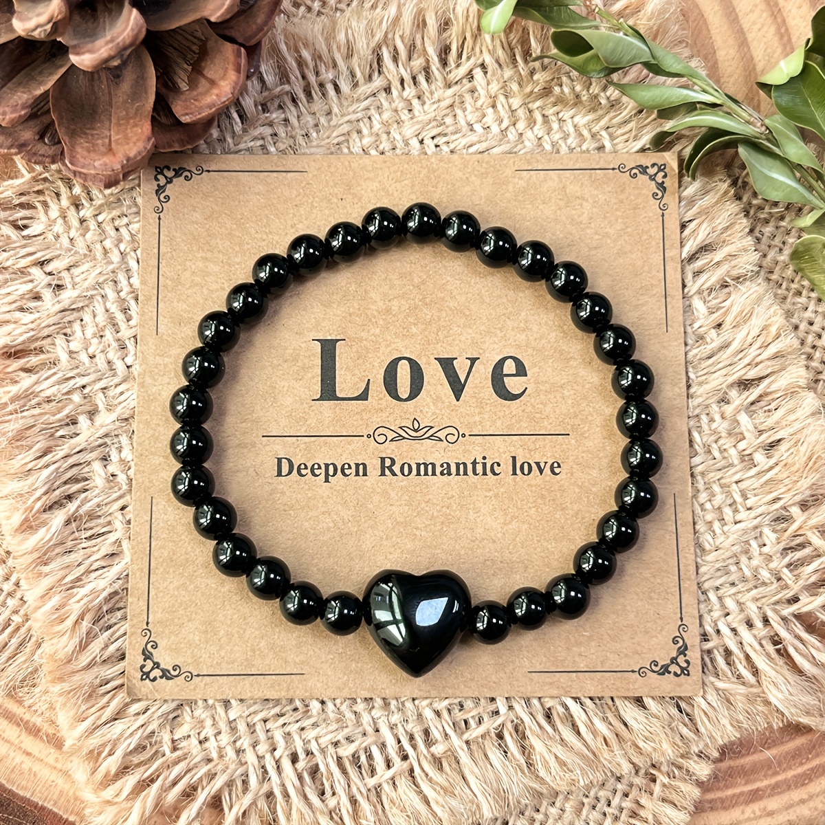 E-shop Ein natürliches Obsidian-Perlenarmband mit einem herzförmigen Anhänger, entworfen, um negative Emotionen abzuwehren und eine Verankerung zu