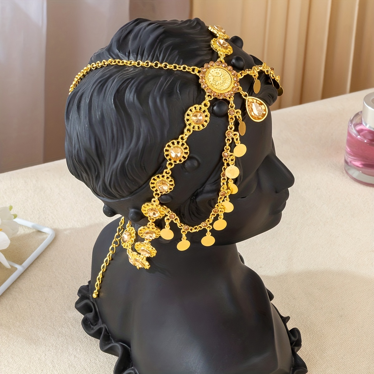 Intricate Carved Forehead Adornment with Golden Coins