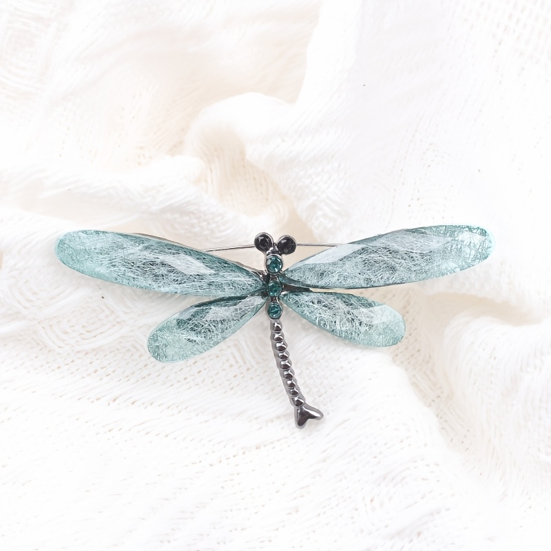 Image of A Single Dragonfly Brooch Featuring Blue And Green Textured Wings With Vibrant Rhinestones, Perfect For Nature-themed Or Art Shows. This Fashion Jewelry Piece, The Insect