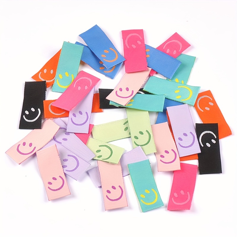 

50pcs Vibrant Face Fabric Labels, 4x1.5cm, Polyester, - Ideal For , Bags & Hair Accessories, Sewable And Craft-friendly, Ribbon Labels, , Hair Accessories, Decorative Accessories