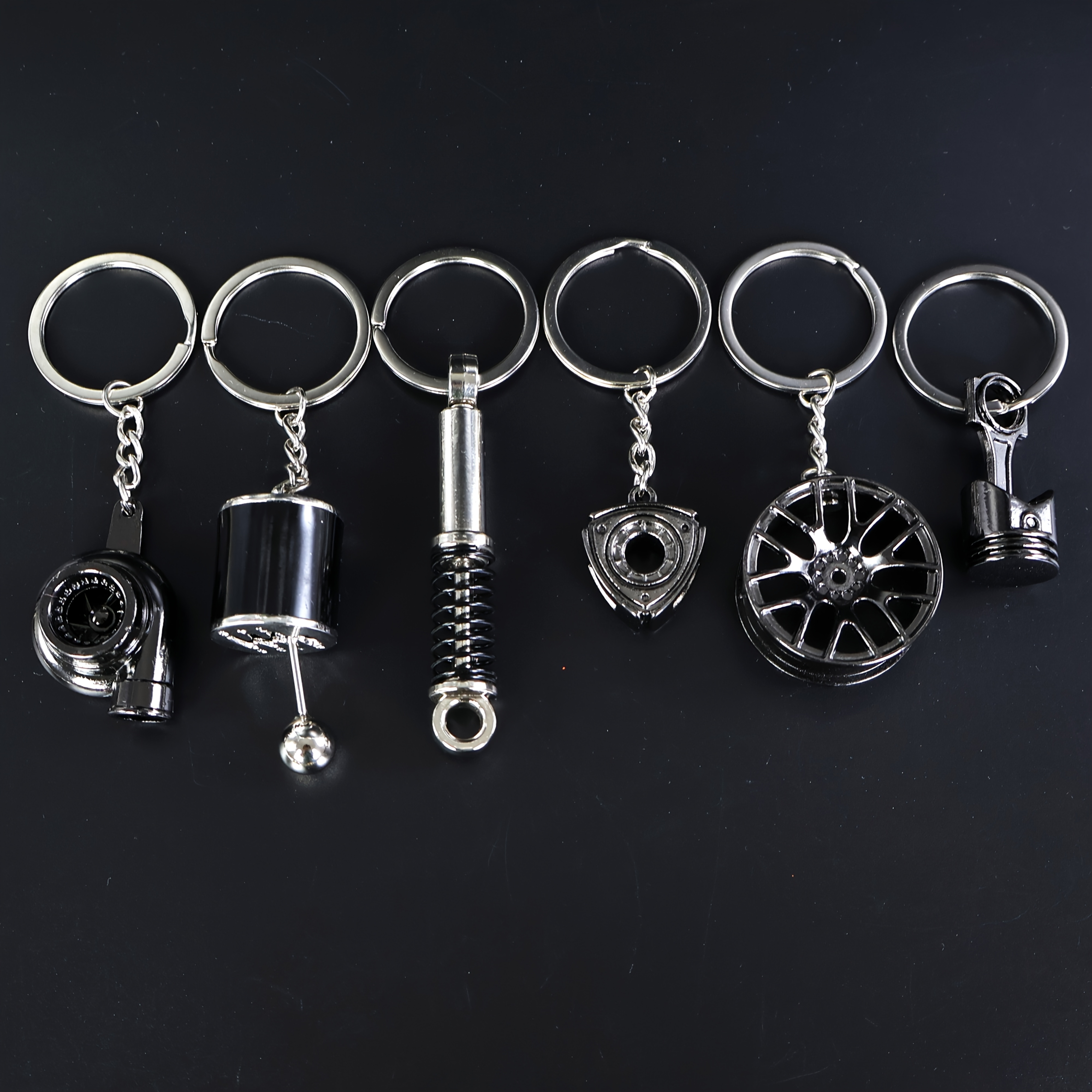 E-shop 6er-Set Auto--Schlüsselanhänger, Lässiger Stil mit Rad, Turbolader, Schaltknauf, Kolben, Stoßdämpfer, Schwungrad, Geschenkkombi-Pack |