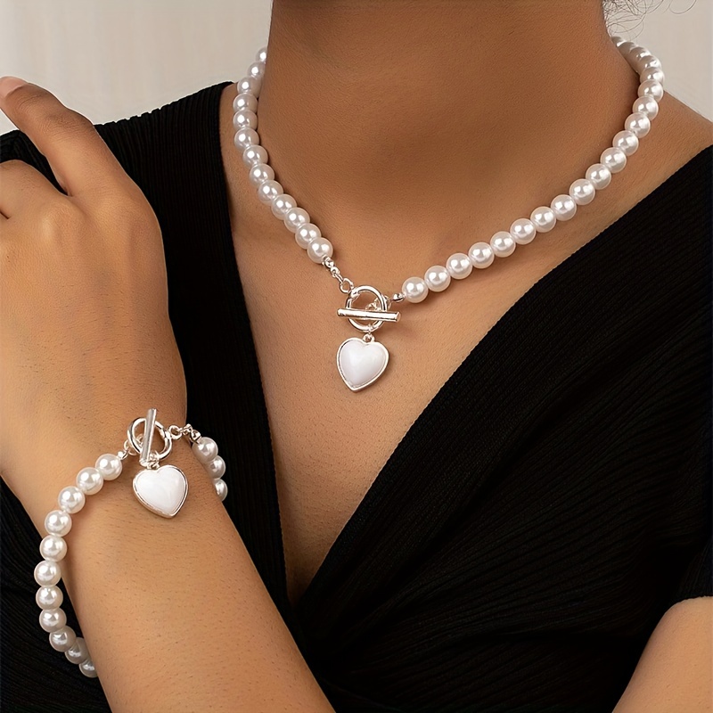 

Elegant Luxury Pearl Jewelry Set For Women, Plastic Heart Charm Necklace And Bracelet Set, Valentine's Day, Weddings, Banquets, And Business Casual