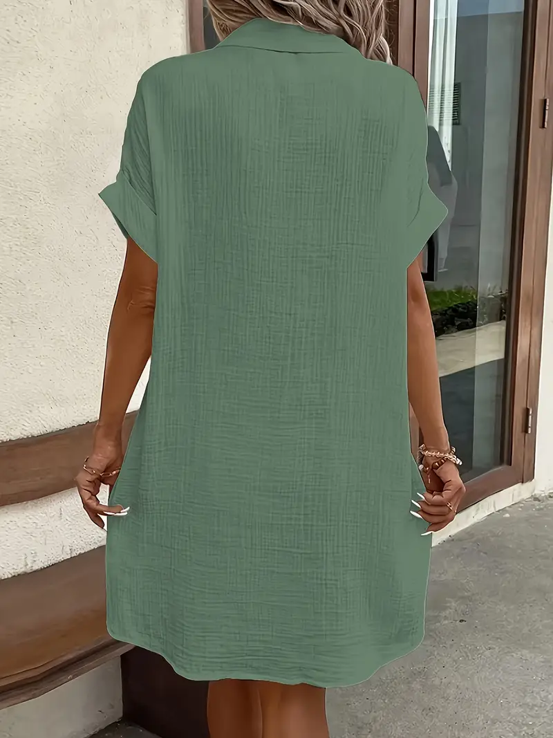 a minimalist white shirt dress made of breathable featuring a sharp collar design and buttons that add a touch of details 11