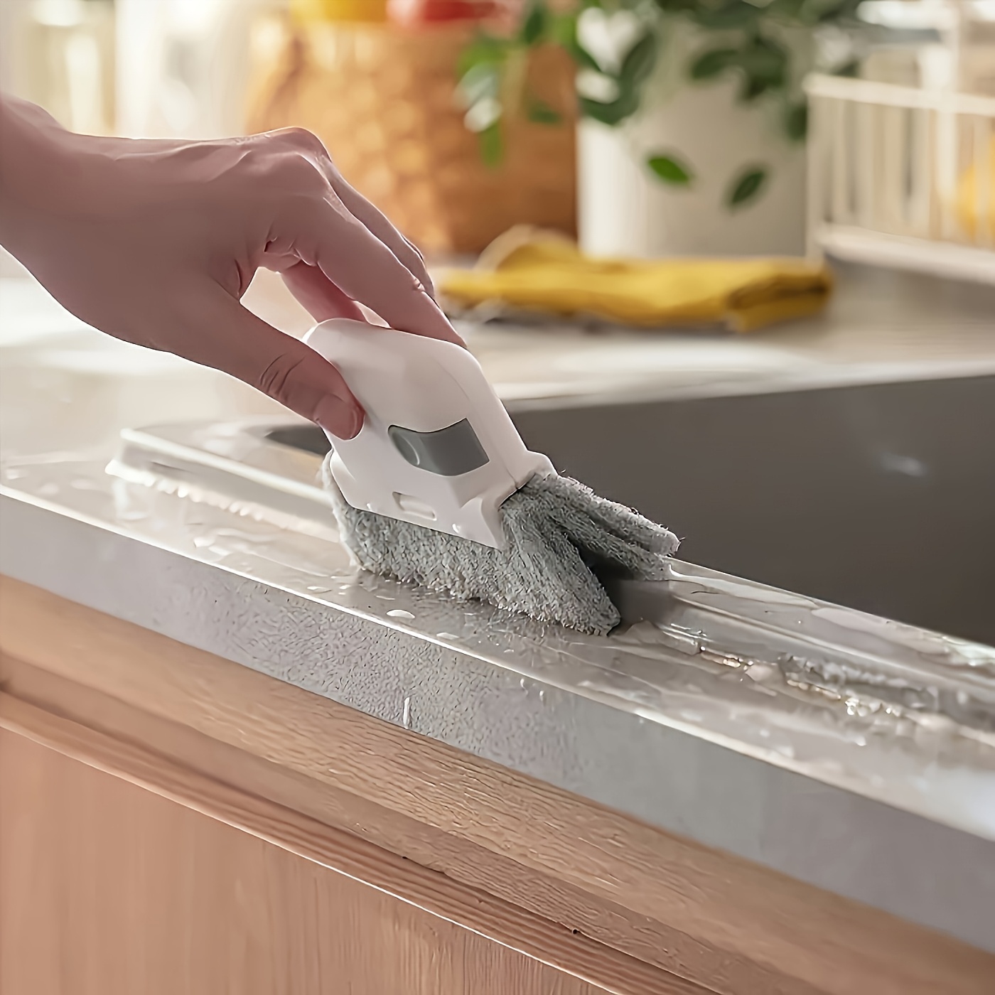 A Versatile Handheld Cleaning Brush Suitable for Windows And Kitchens - Features Easy-To-Use Grooves And Crevice Tools, a Reusable Essential for Dusting at Home.
