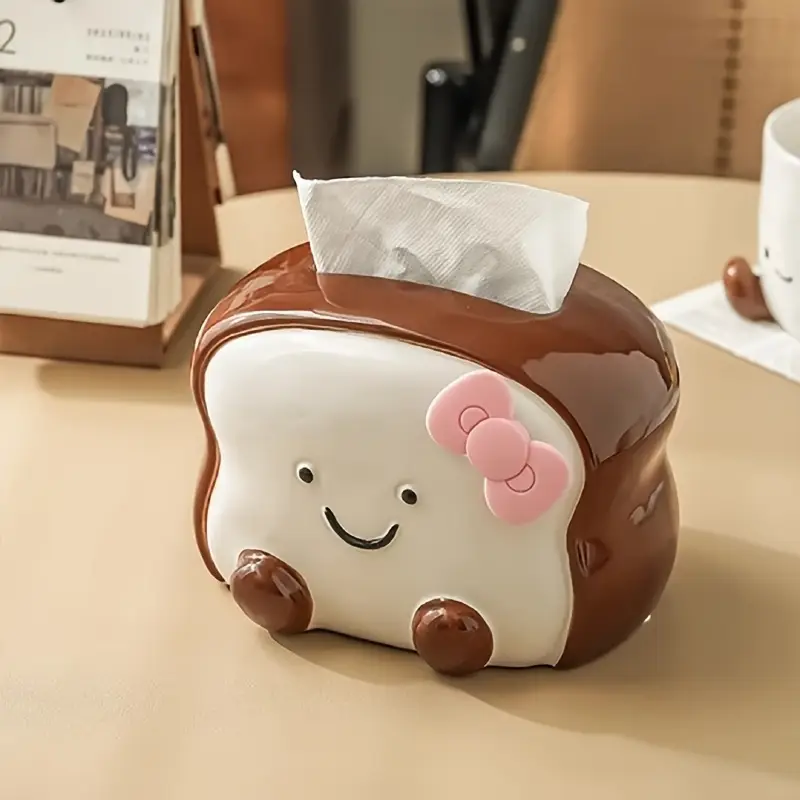visually appealing toast shaped ceramic tissue box holder smiling bread design with pink flower detail accents living room bedroom or kitchen decor Product details 3