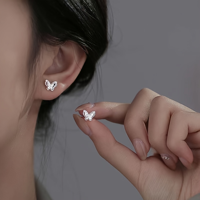 a pair of ladies fashionable hollow   stud earrings with 925 spiral silvery   featuring a silvery plating for a minimalistic light luxury look suitable for daily wear parties vacations and making great gifts Product details 5