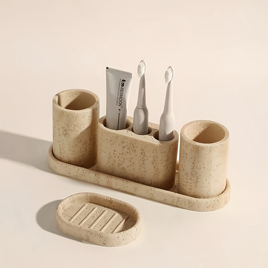 a single resin bathroom set featuring a toothbrush holder soap dish storage rack imitation stone additions decorative items for the bathroom and a gift for graduation