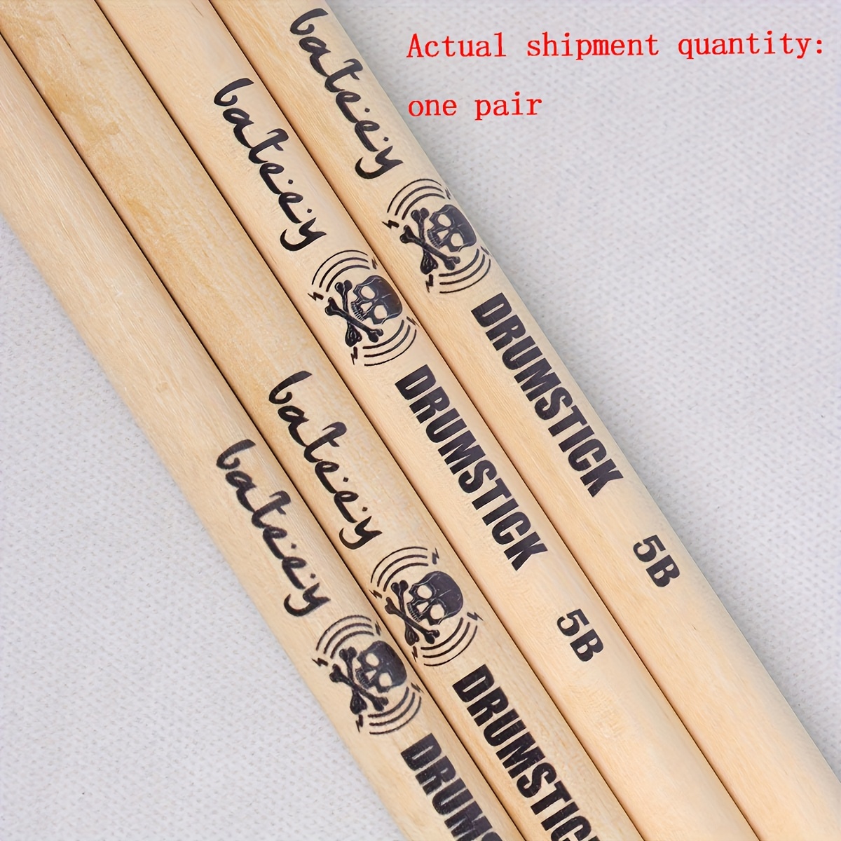 A Pair Of High-quality Maple Drumsticks With A Skeleton Pattern In Natural , In 5a, 7a, And 5b Sizes