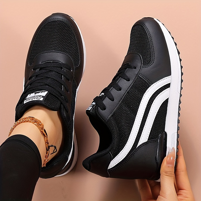 Black ladies wedge sneakers sold by 100 Spartans