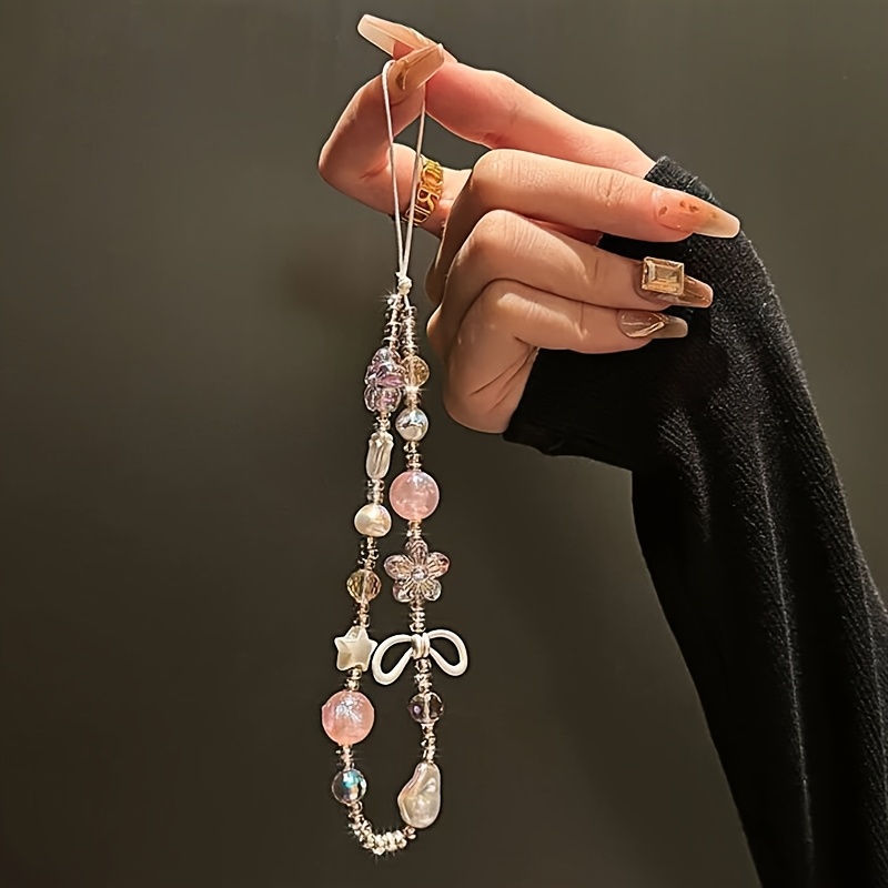 E-shop Süße Kühle Wind Perlen Handyketten Rosa Blumen Schleifen Anhänger Damen CCD Kamera Kette Acryl Handyhülle Universelle Dekorative Accessoires