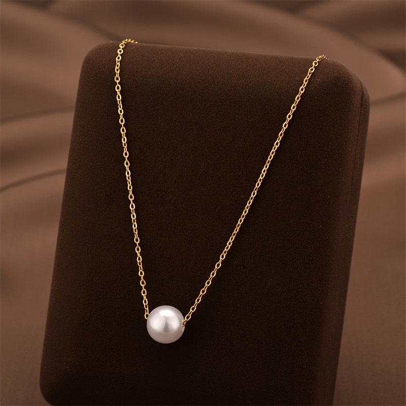 elegant golden alloy necklace with white imitation pearl pendant suitable for daily wear and parties an ideal valentines day gift