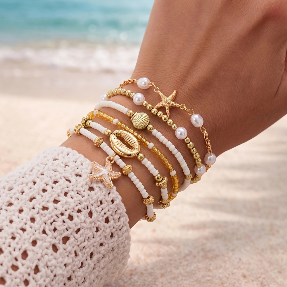 E-shop 6-teiliges Set eleganter Acryl-Perlenarmbänder mit Seestern und anderen Elementen, als Geschenk für Männer und Frauen zu Urlaubspartys oder für