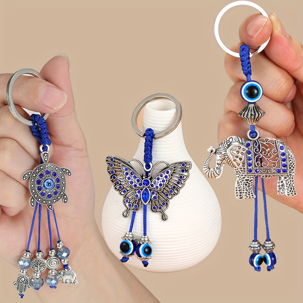 E-shop Evil Eye Schlüsselanhänger Set 3-teilig Schildkröte, Schmetterling und Elefant Blaues Auge Quasten Schlüsselanhänger Glücksbringer