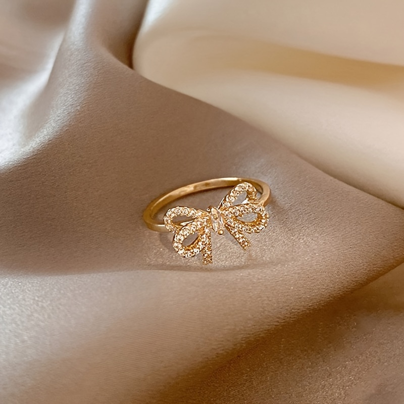Golden Tone Bow Knot Ring with Sparkling Cubic Zirconia Accents