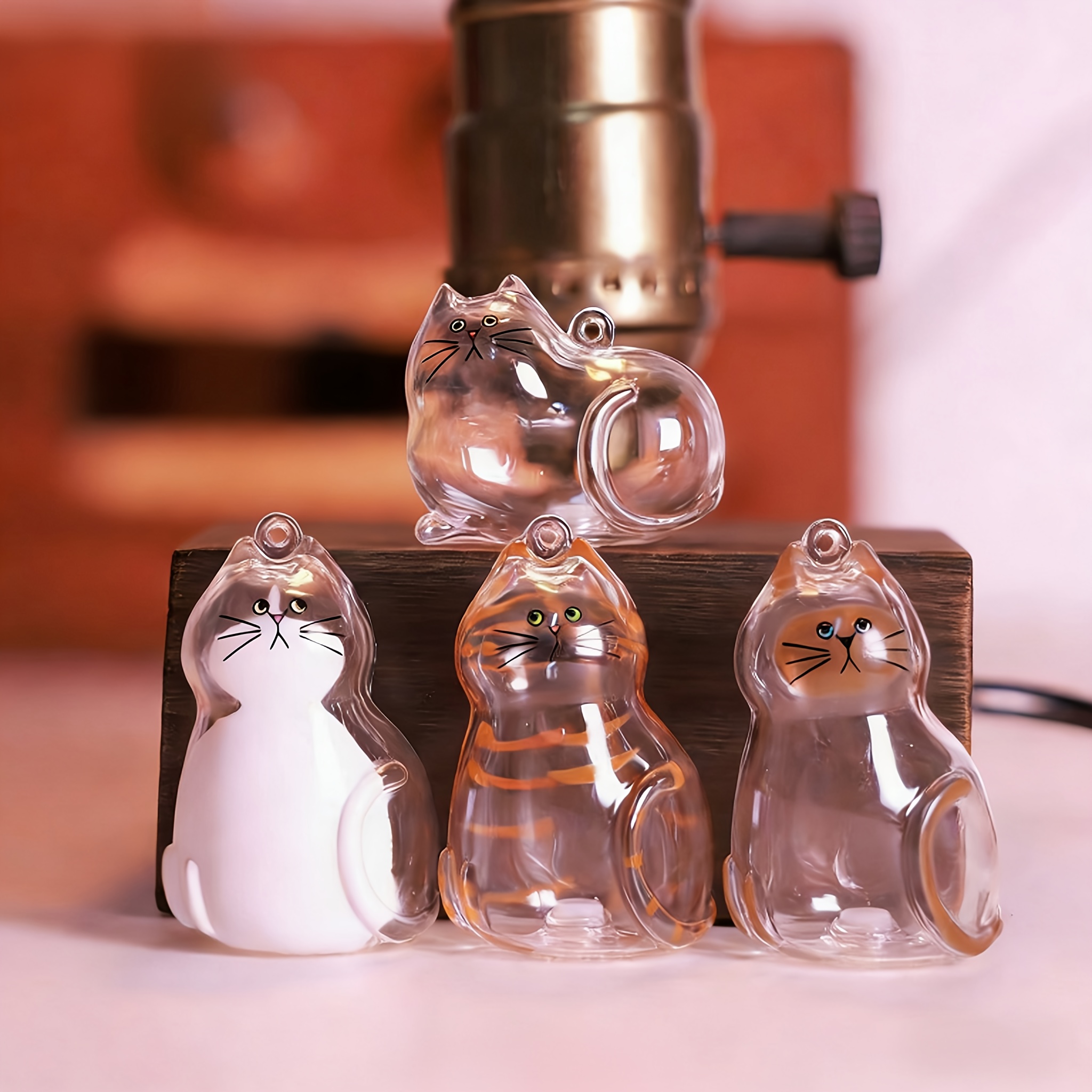 Image of A 4pcs Capsule For Cat Memorials Featuring An Adorable , This Cat-shaped Container Is Perfect For Storing Pet Hair And With A Hanging Ring, Making It A Thoughtful Gift For Grieving Cat Owners