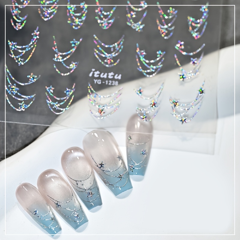 Image of Star Chain Nail Stickers With Aurora Brilliance, Featuring Golden And Silvery Lines And Star Chain Designs For Nail Art
