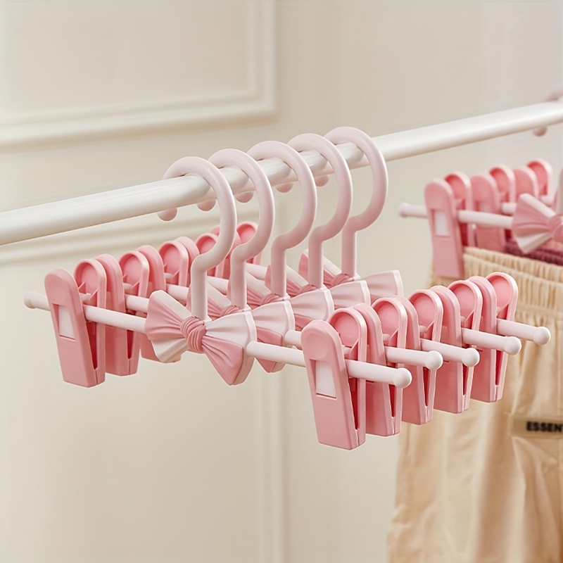 

Retractable 11-27 Inch Plastic Pants Hanger With Bow Clips - Perfect For Kids' Clothes