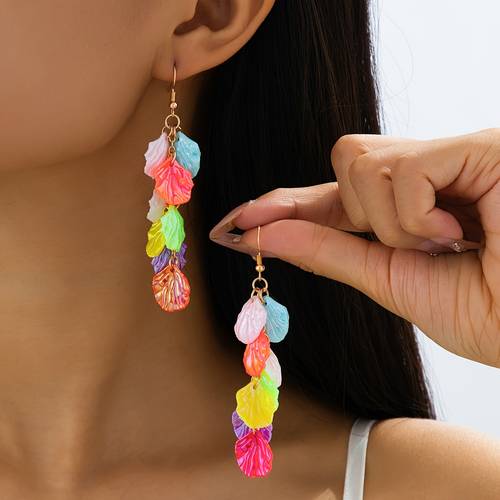 a pair of colorful acrylic shell tassel earrings that are stylish vintage cute and sweet featuring geometric and vibrant bohemian looks romantic and elegant earrings are ideal for everyday wear dates