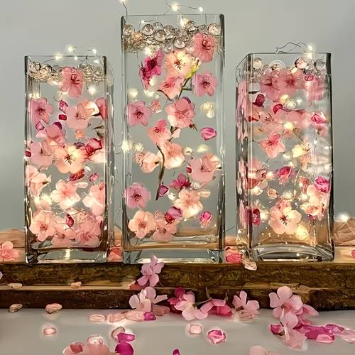 a collection of 200 artificial cherry pieces along with pink acrylic beads vase embellishments ideal for use as a centerpiece for floating candles this set is great for wedding tables parties and home decor
