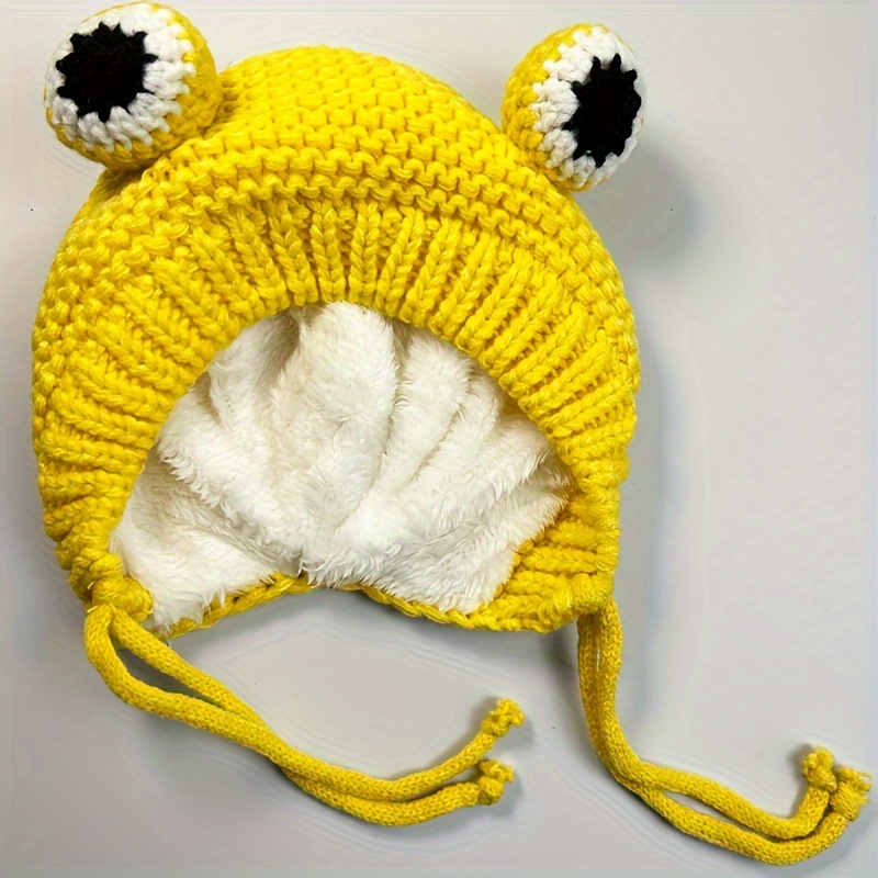 Sombrero de niña con orejeras de lana de ganchillo hecho a mano en