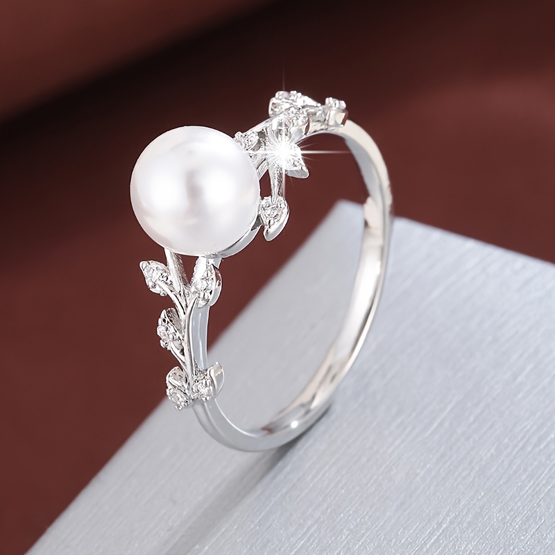 טבעת אלגנטית בעיצוב ענף זית ועלה עם זירקוניה מתנה מעוקבת ופנינה מלאת יומית