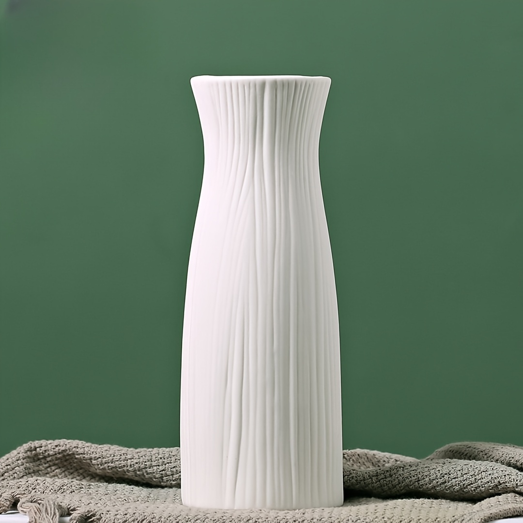 a white plastic vase hold artificial dried flowers suitable