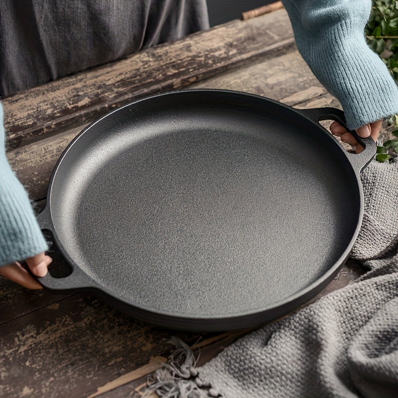 

A Cast Iron , Suitable For Pizza, Grilling, Pancakes, And More. On All Types Of And Is An For Home Kitchens And , Requiring No Electricity.