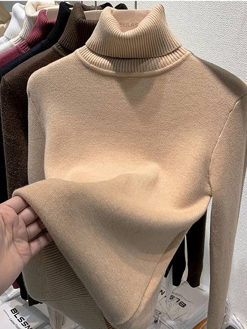 a cozy high neck fleece sweater made from medium stretch material keeping warm during the autumn and winter