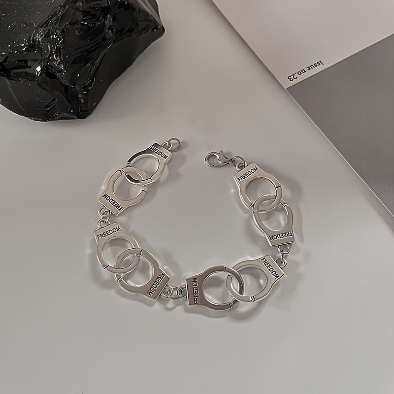 Image of Handcuffs, Bracelets, And Wristbands