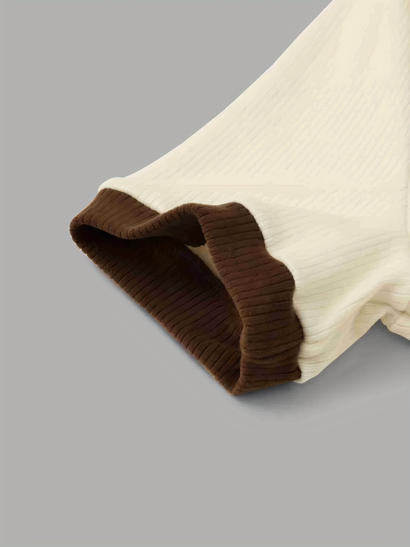 Detail of the waistband and removable belt on the casual pants