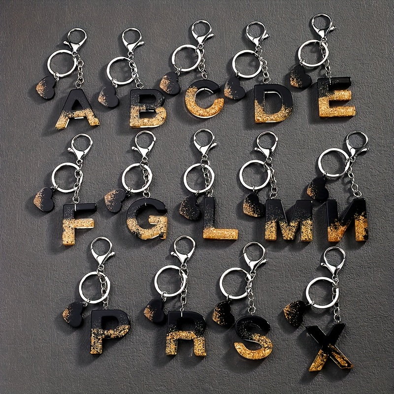 

A Stylish European And American Resin Keychain -shaped English Letters Pendant, A Personalized High-end For Men And Women.