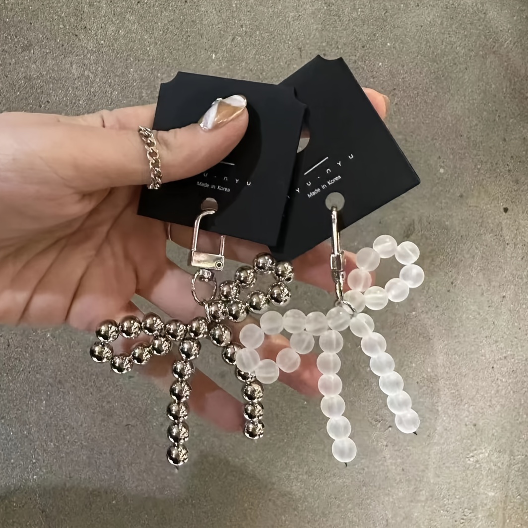 

A Cute Girl Keychain With An Instagram Style, Pearl Butterfly Bow Phone Chain Keychain For Daily Gatherings And Valentine's Day.