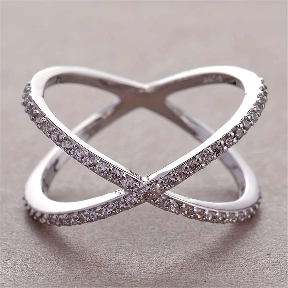 Image of A Stylish And 's Ring With A Simple And Creative X-shaped Design, Set With Synthetic Zirconia, Suitable For Ladies To Wear , Daily Life, And Parties.