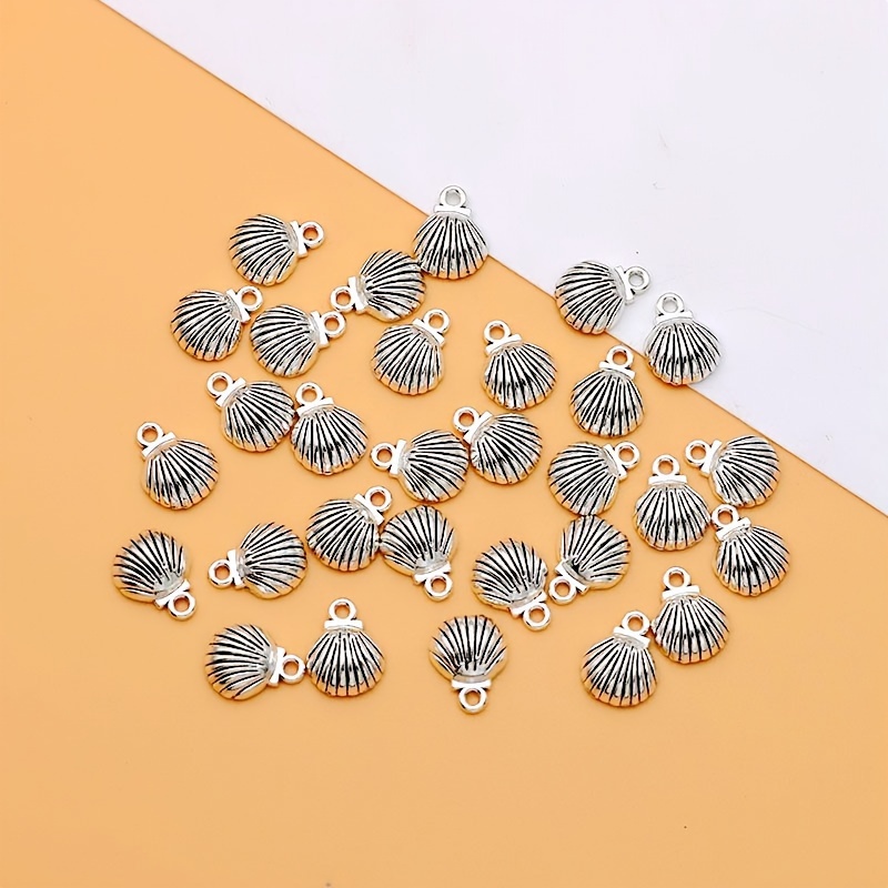 

Lot de 30 Breloques en Coquillage Antique Argenté, Pendentifs en de Zinc pour Bracelets, Boucles d'Oreilles & DIY