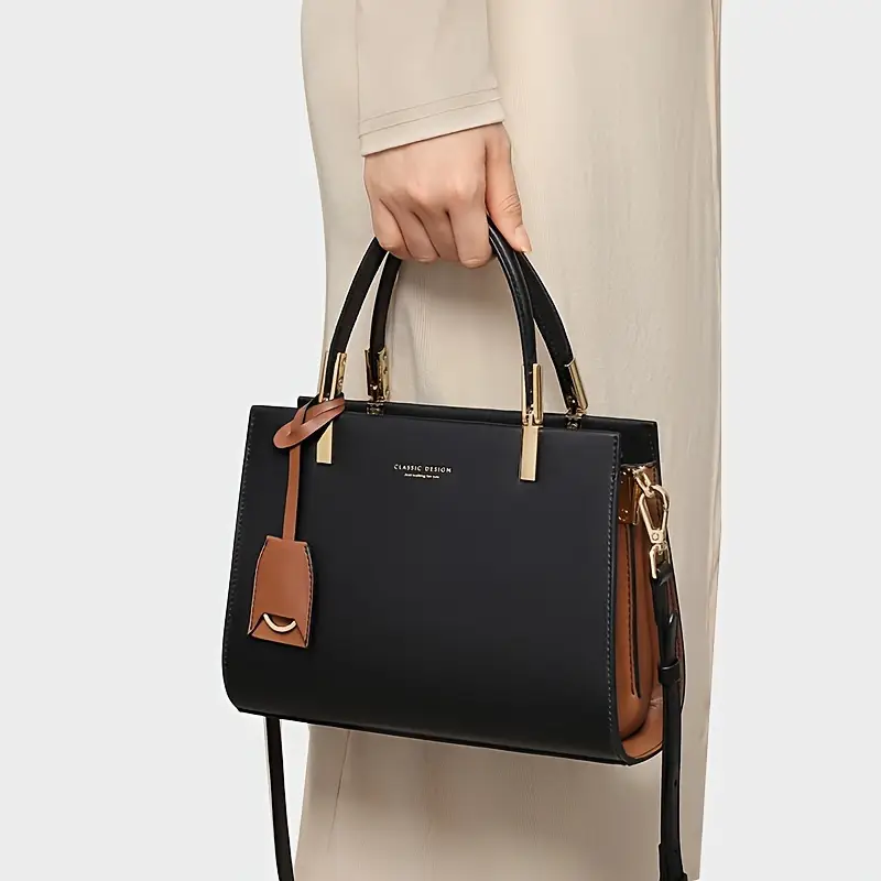 elegant genuine leather tote handbag by cobbler legend zip closure removable strap and tassel detail everyday use Product details 0